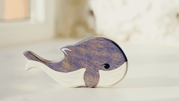 Close shot of a whale-shaped wooden toy