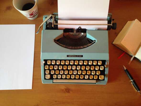 Typewriter with cup of coffee